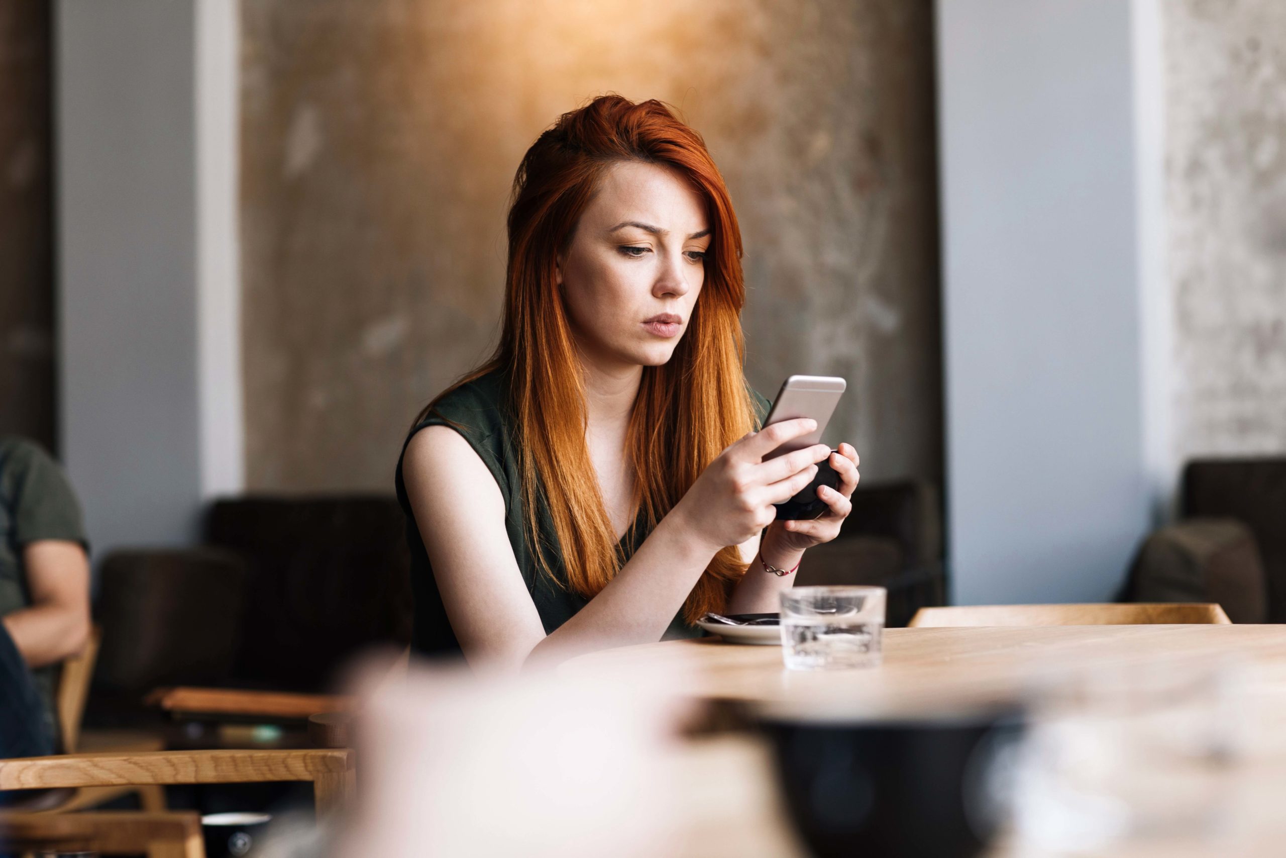 Woman checking social media on her smartphone