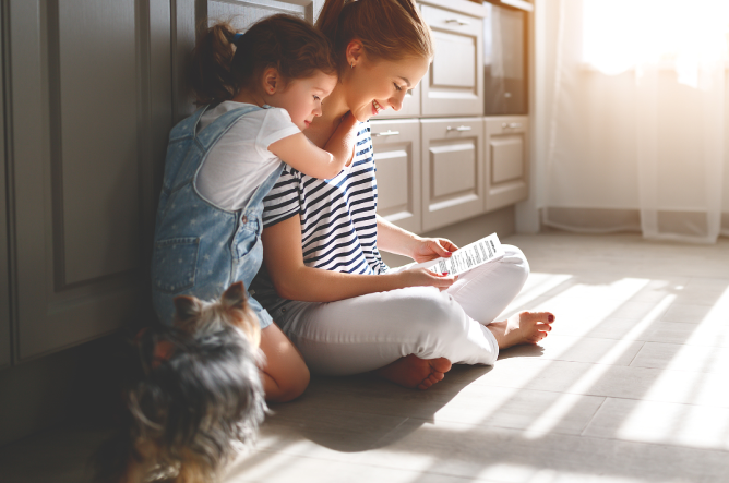 Woman with small daughter and pet Yorkie dog reviewing her Last Testament & Will