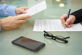 Woman signing contract