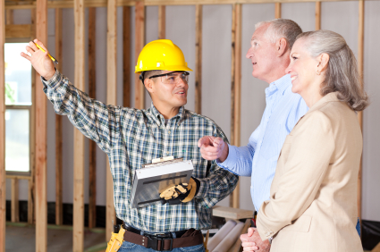 Couple talking to construction contractor