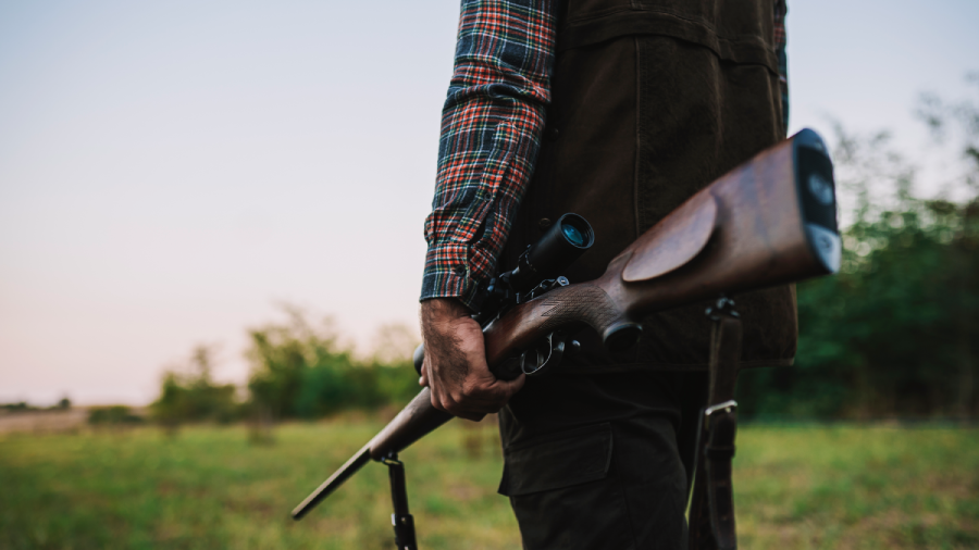 Hunter carrying a rifle