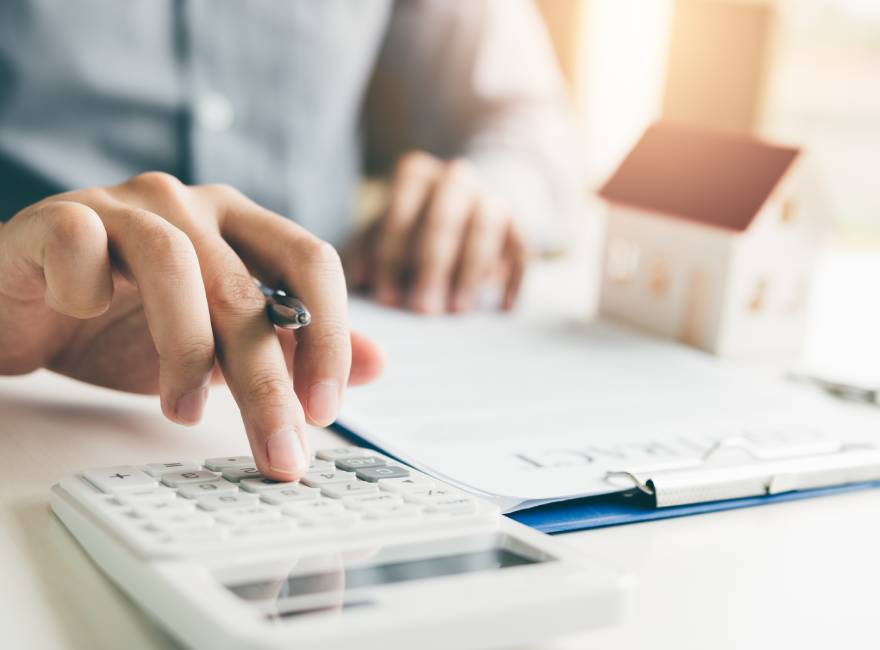 Landlord using a calculator