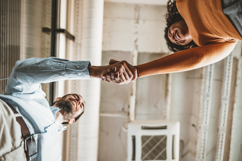 Man and woman shaking hands