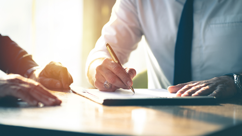 Man signing a contract