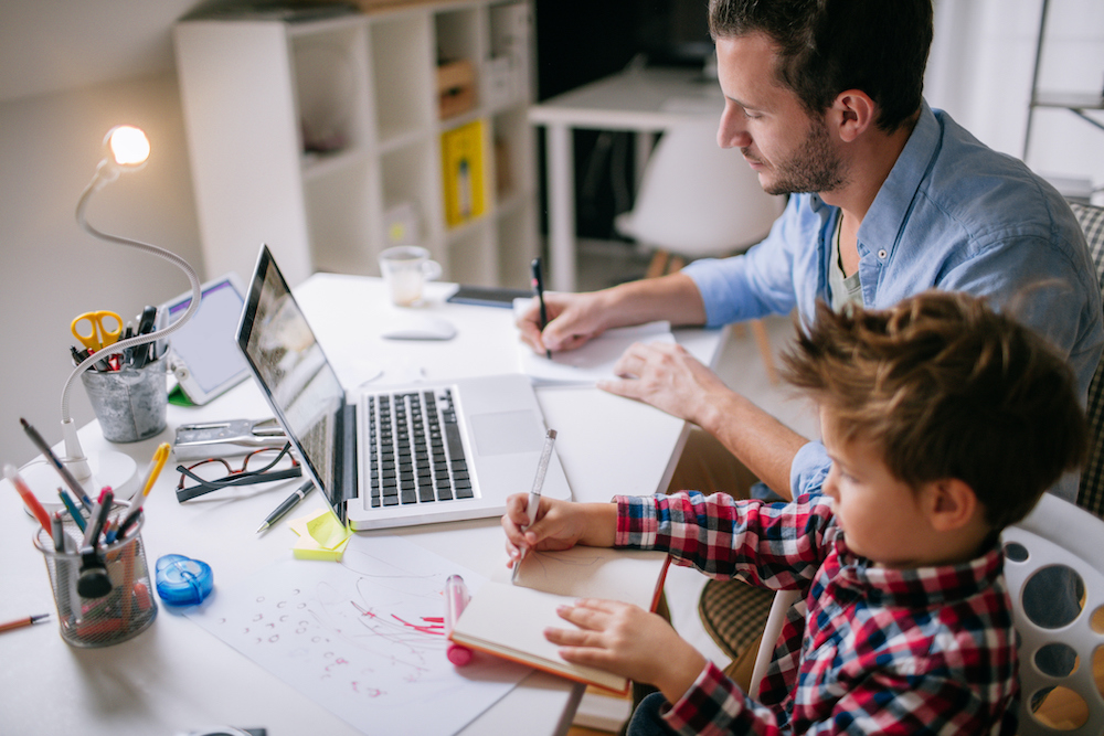 Man and boy at desk