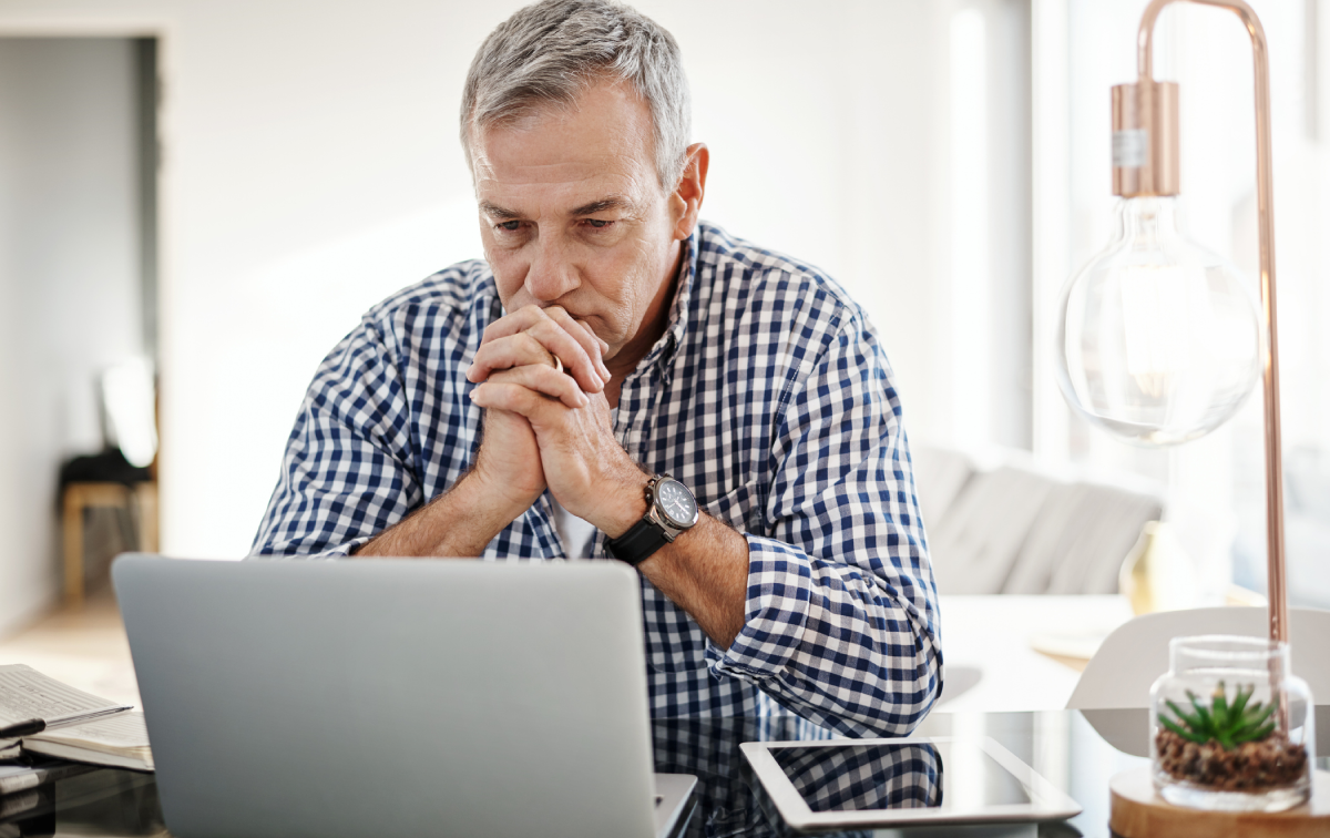 Man reviewing types of Wills on a laptop