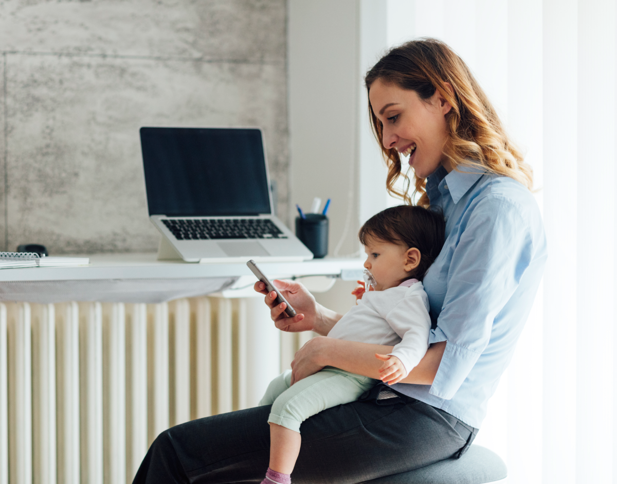 Working mother holding child