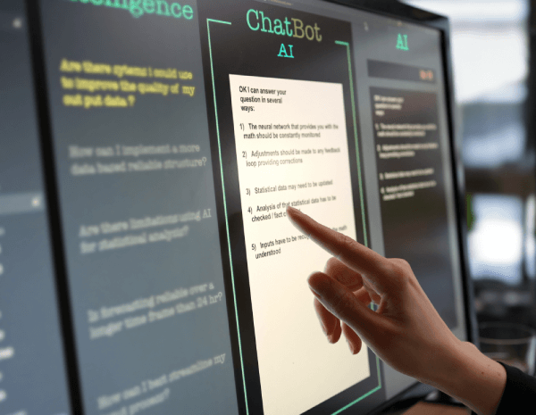 Woman pointing to a computer monitor as she using an online AI ChatBot to create a legal document.