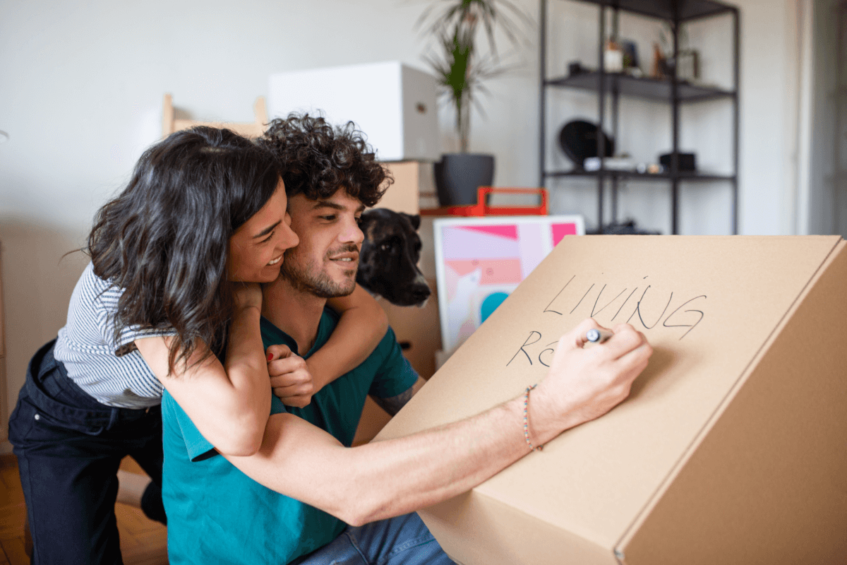 Renters labeling moving boxes