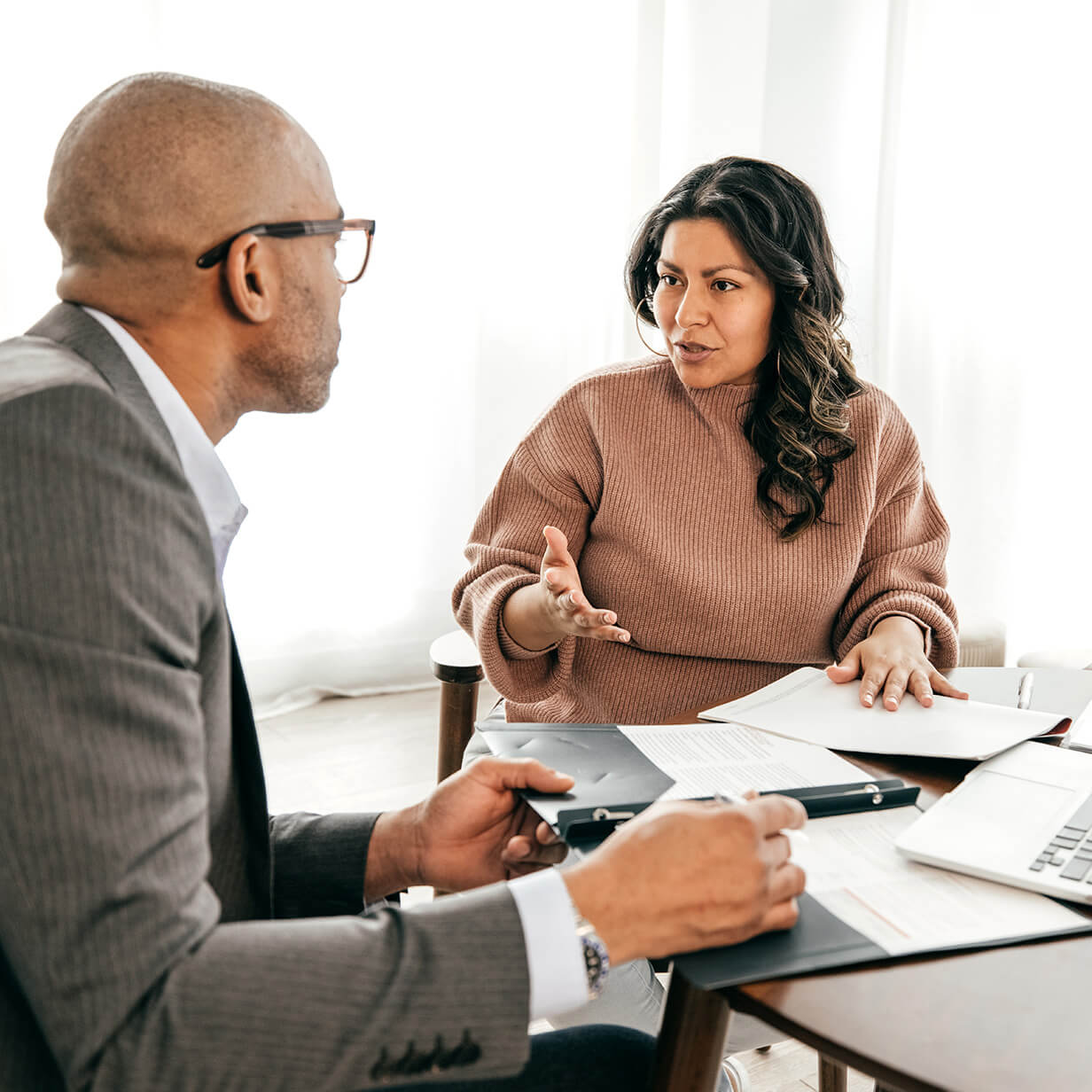 Woman asking questions about a lease agreement.