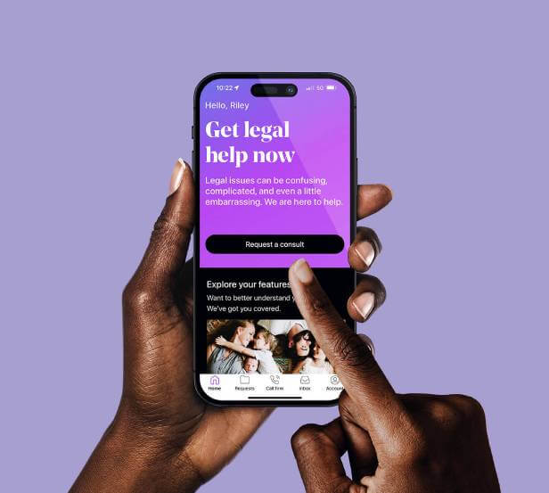 Woman holding a phone showing LegalShield app screen that reads Get legal help now.